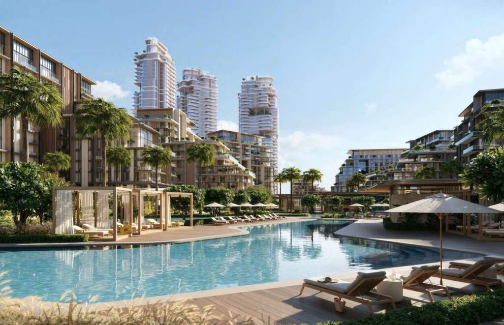 Resort pool with cabanas and palms beneath residential buildings at City Walk Crestlane, City Walk, Dubai