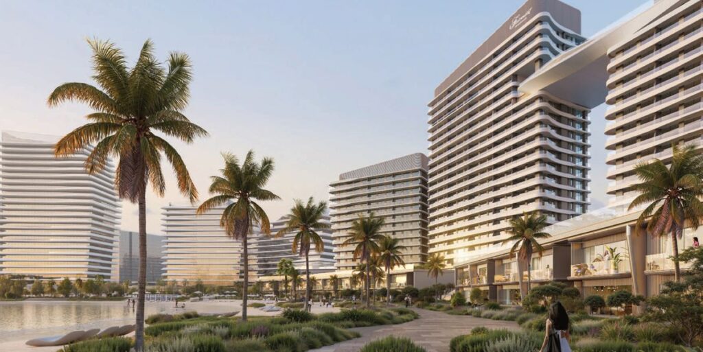 Palm lined promenade beside the curved Fairmont Residences towers, Al Marjan Island, Ras Al Khaimah