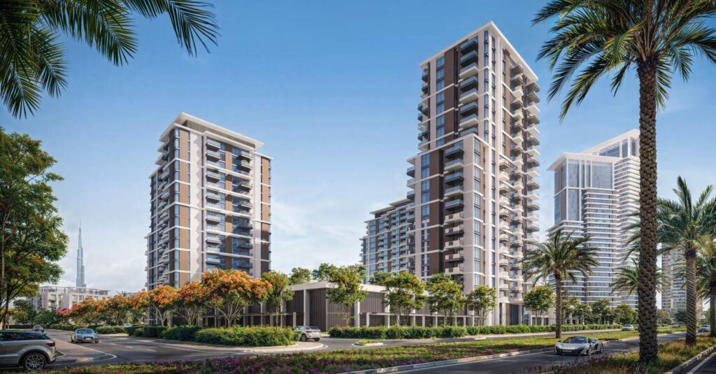 Naya at District One towers along a tree lined avenue