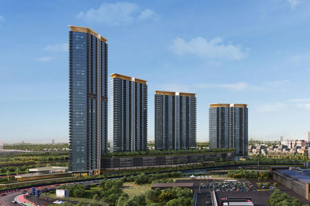 Four residential towers rising above green parkland at Sobha Solis, Motor City, Dubai