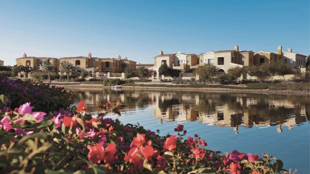 Lakeside villas with bougainvillea at Arabian Ranches, Dubailand