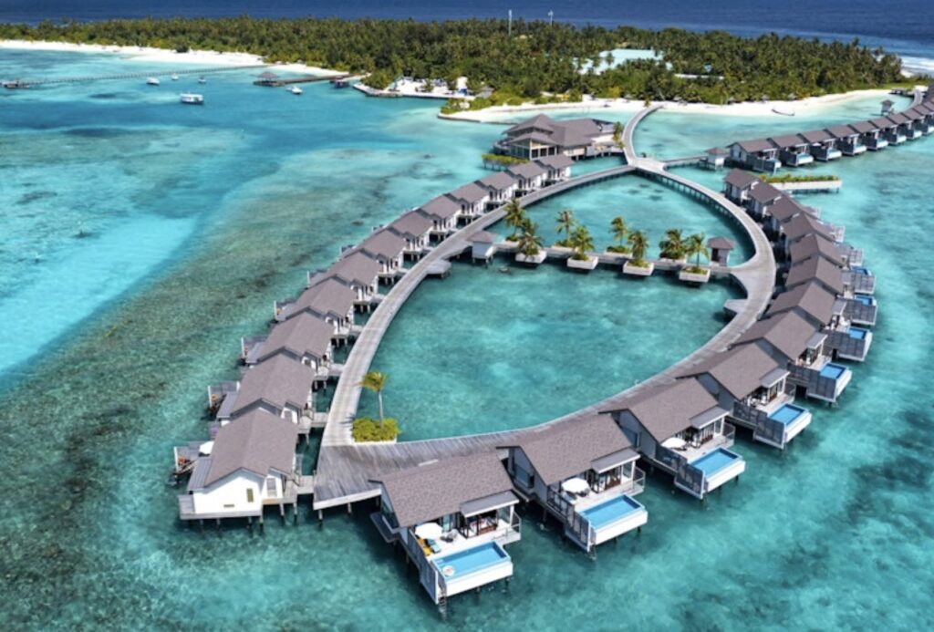 Overwater villas in a turquoise lagoon, resort imagery for Arka Enclave, Dubai Islands