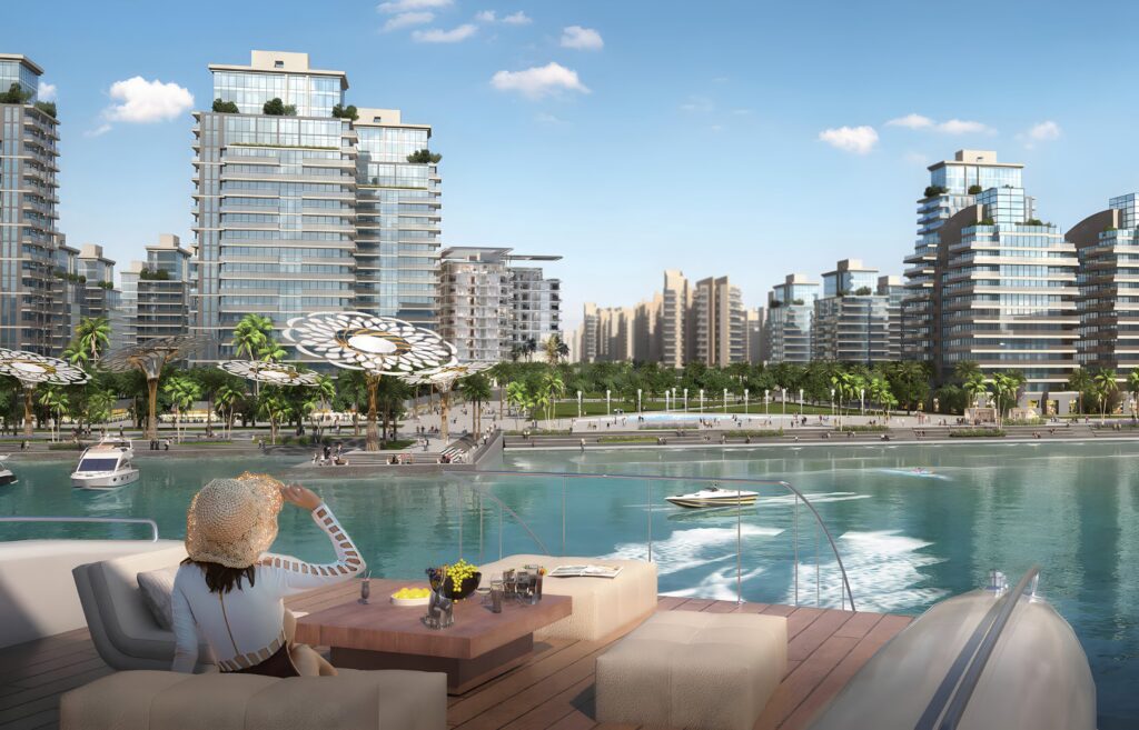 Waterfront lounge with yacht and towers beyond at Arka Enclave, Dubai Islands