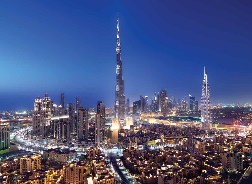 Downtown Dubai skyline at night with Burj Khalifa near BLVD Heights