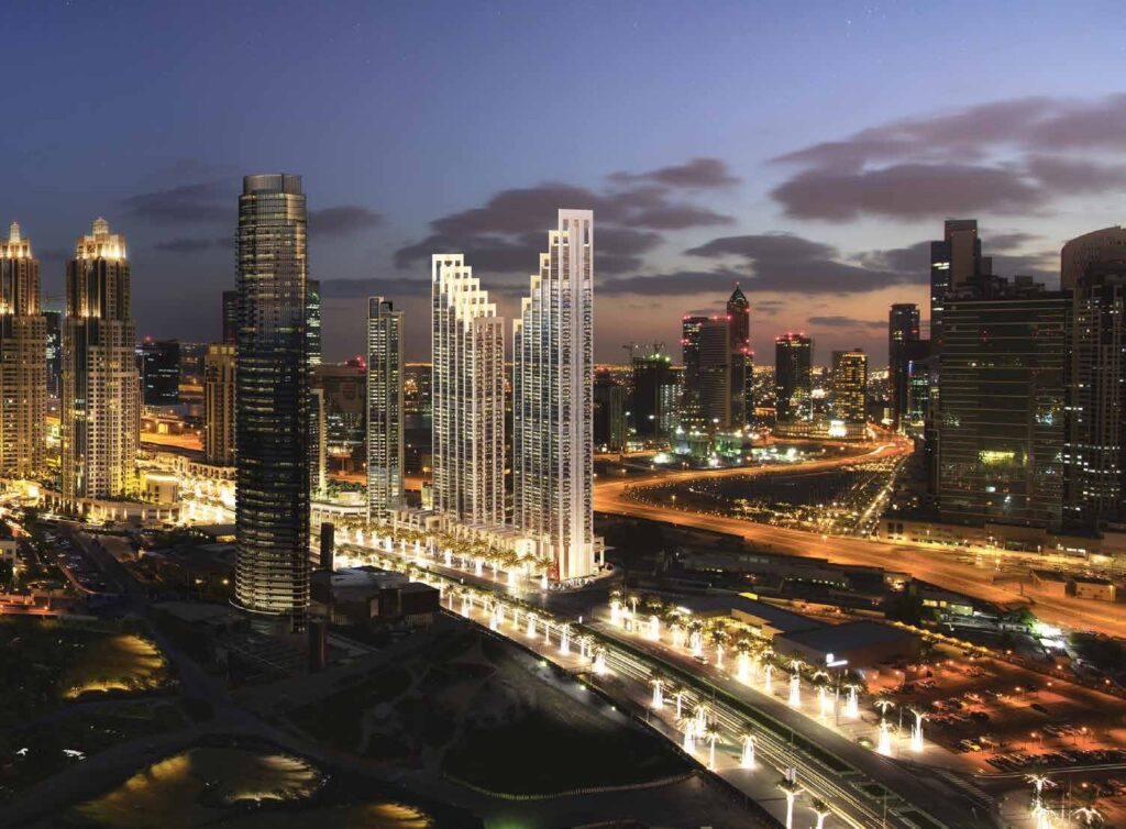 BLVD Heights towers lit at night along the boulevard, Downtown Dubai