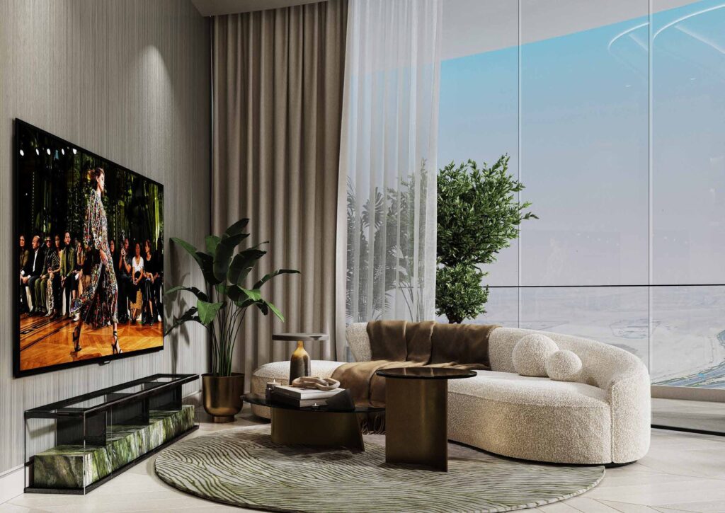 Living room with large TV and curved sofa at Canal Crown de Grisogono, Business Bay