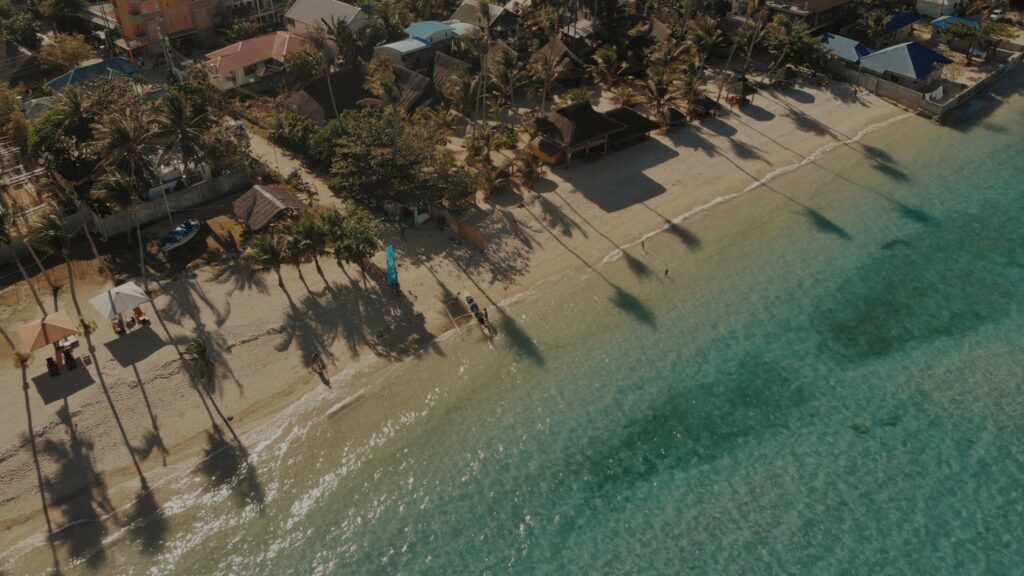 Aerial view of a palm lined beach near DreamLife Residences, Dubai Islands