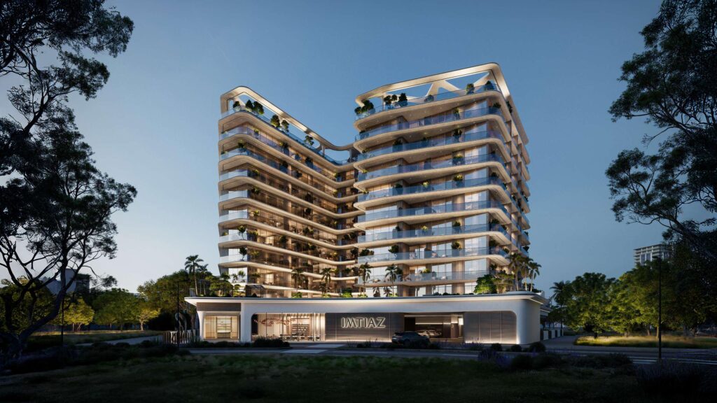 Enre Residence residential tower with curved balconies among trees, Dubai South