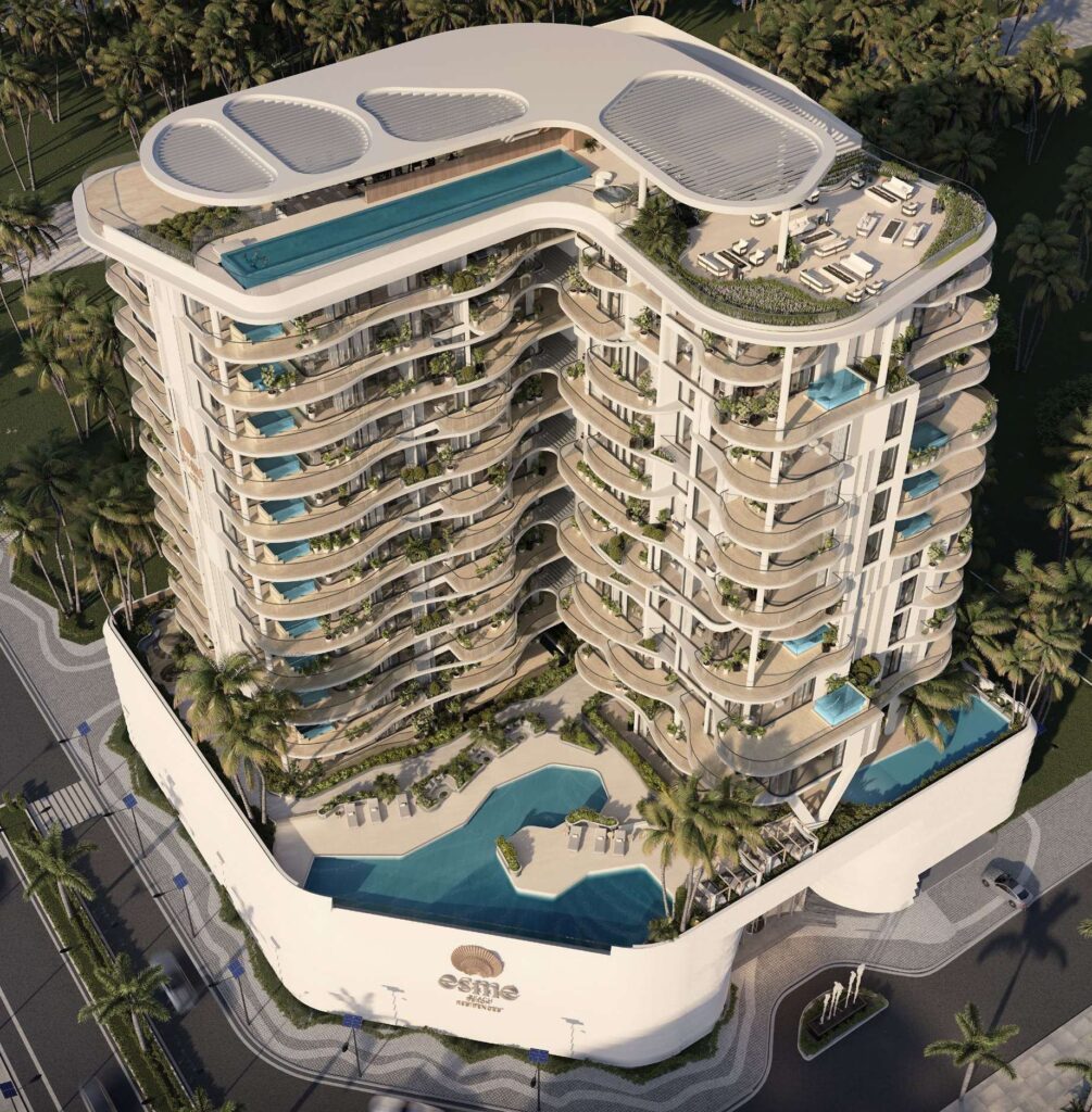 Aerial view of Esme Beach Residences with rooftop and podium pools