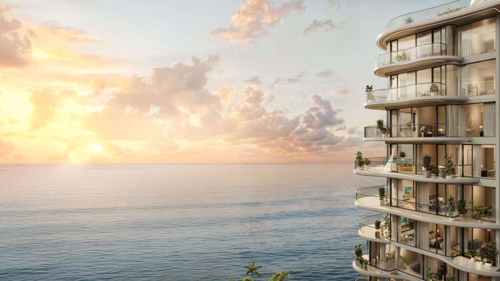 Curved balconies of Esme Beach Residences facing the sea at sunset