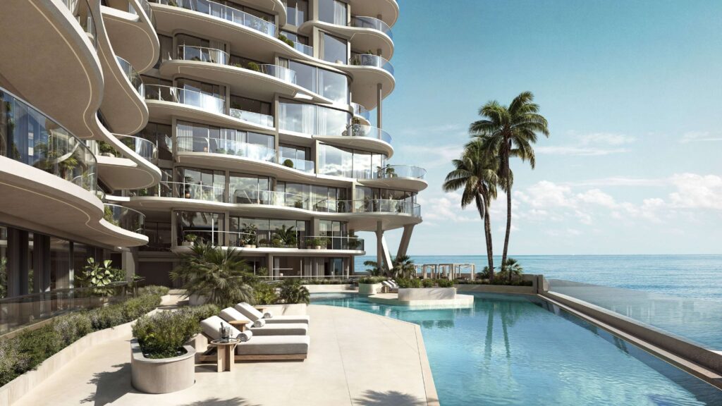 Infinity pool deck beside Esme Beach Residences facing the sea