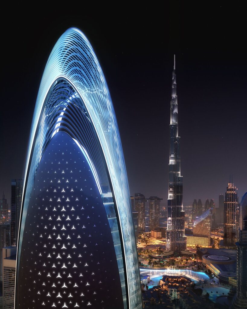 Lit crown of the Mercedes Benz Places by Binghatti tower beside Burj Khalifa at night, Downtown Dubai