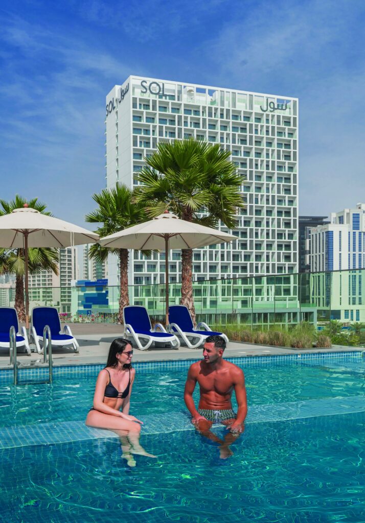 Couple in the rooftop pool at SOL Bay, Business Bay