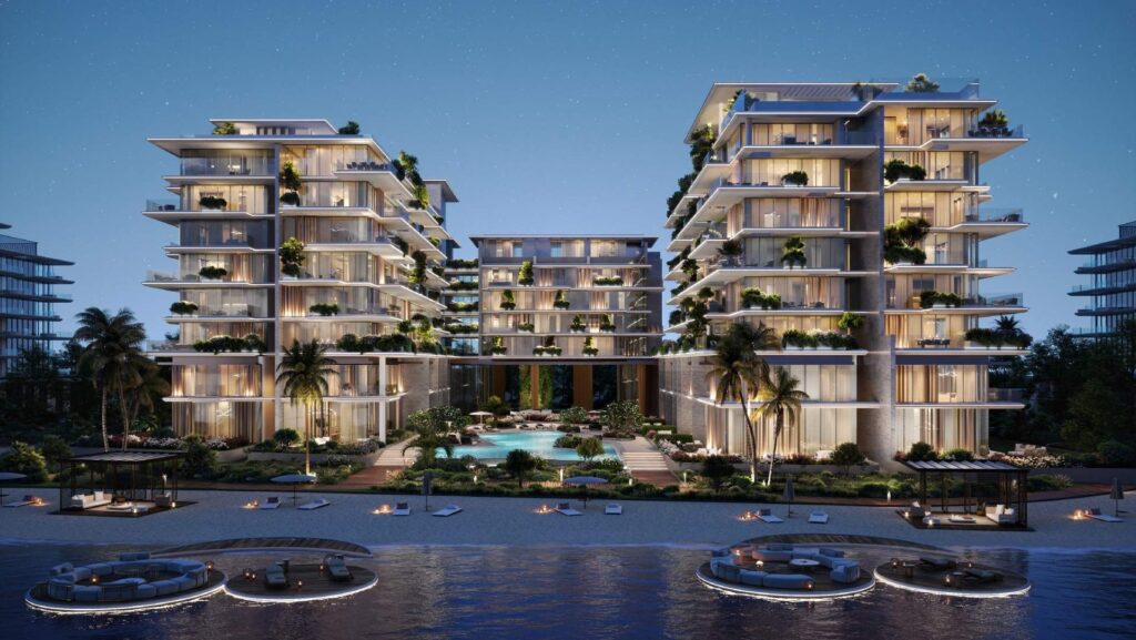 Silena Residences beachfront buildings lit at dusk above the pool, Dubai Islands