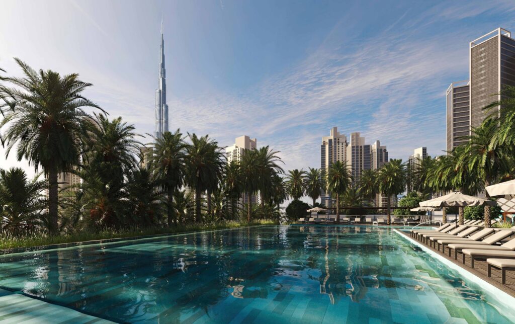 Pool deck with palm trees and Burj Khalifa view at The EDGE by Select Group, Business Bay
