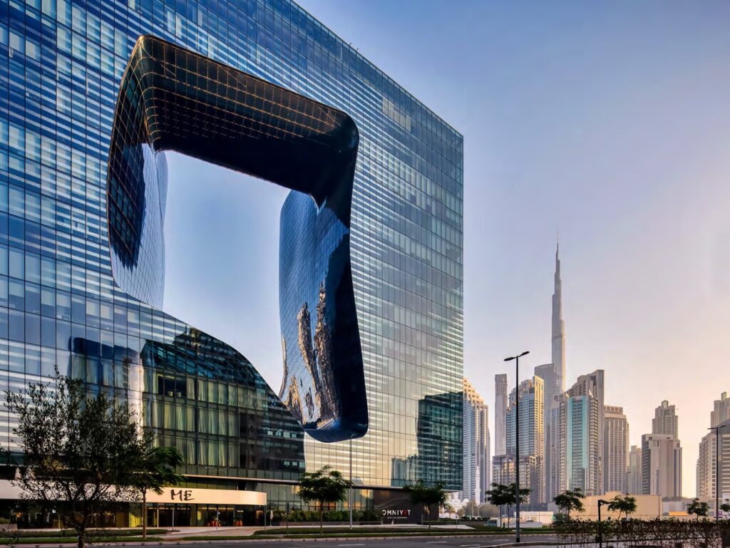 The Opus by Omniyat glass cube with its signature void and Burj Khalifa behind, Business Bay