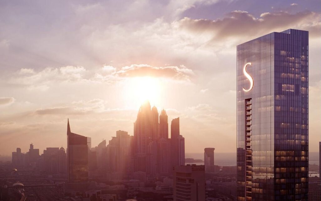 The S Tower by Sobha at sunset beside the Dubai skyline