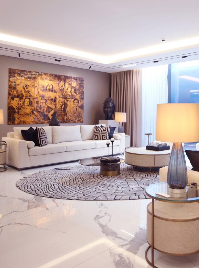 Living room with artwork and floor lamp at The S Tower by Sobha, Dubai