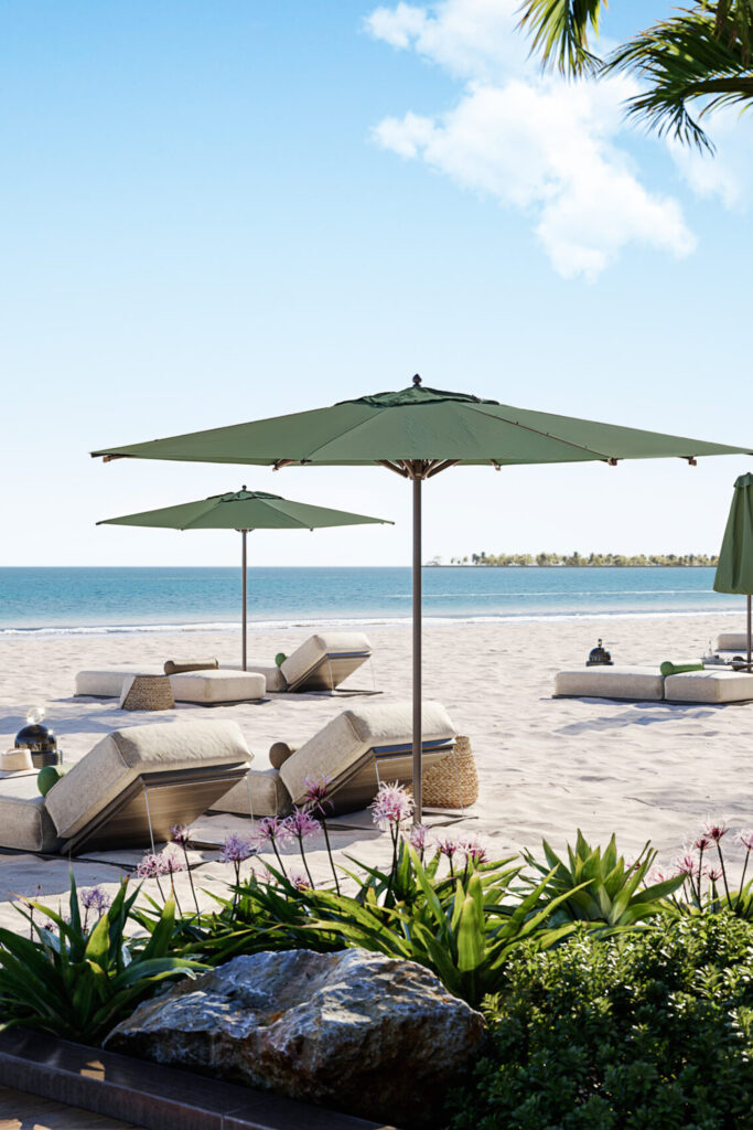 Beach loungers under parasols on white sand, Avenew Development properties in Dubai