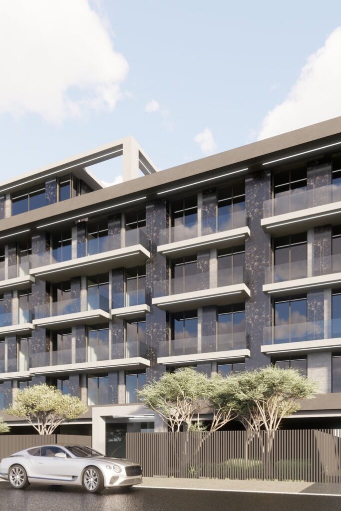 Low rise apartment building with balconies and garden frontage, Greenfield Living developer properties in Dubai