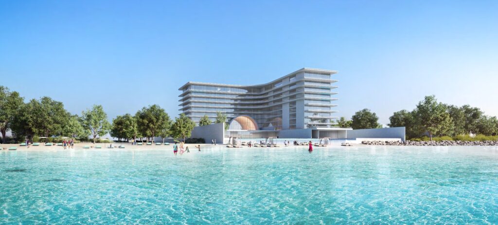 Armani Beach Residences seen across turquoise water from the beach, Palm Jumeirah