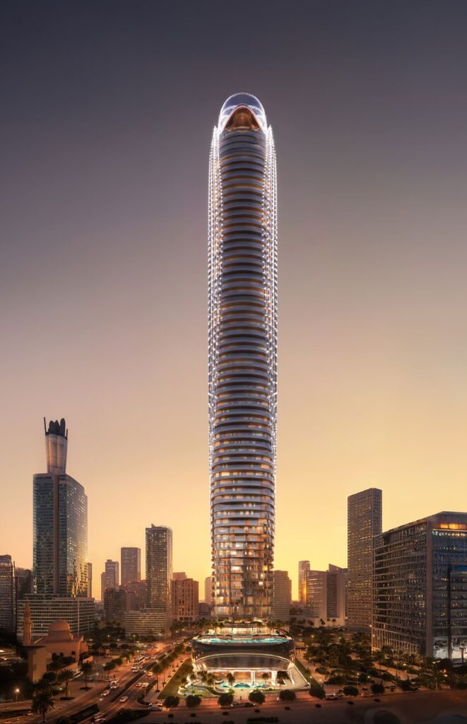 Full height view of the illuminated tower at twilight at Binghatti Skyblade, Downtown Dubai