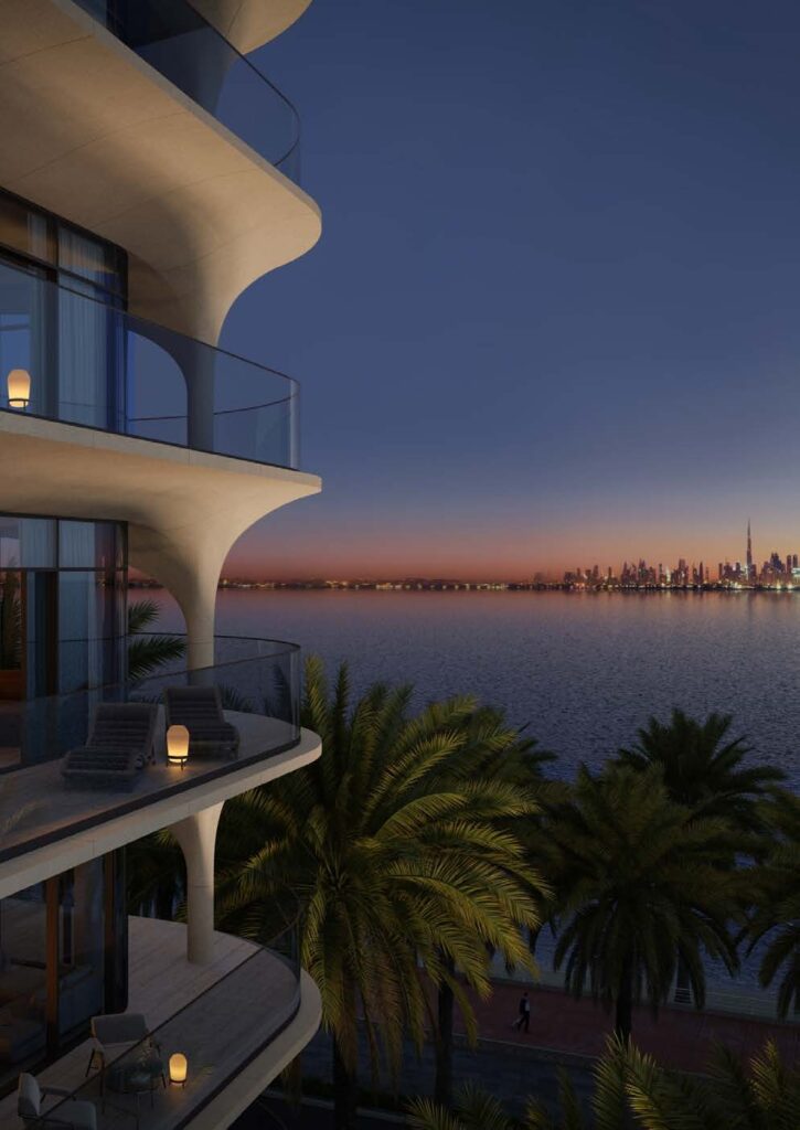 Curved balconies of Ellington Ocean House at dusk with palm trees, Palm Jumeirah