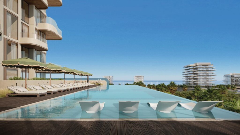 Infinity pool with sun loungers on the House of Well terrace, Dubai Islands