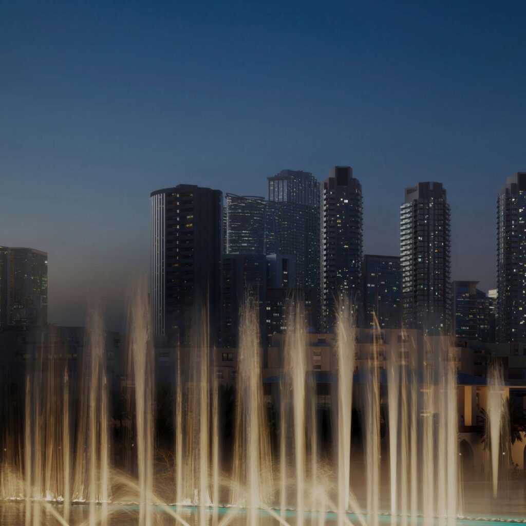Dubai Fountain show in front of the Downtown skyline near Inaura Hotels and Residences