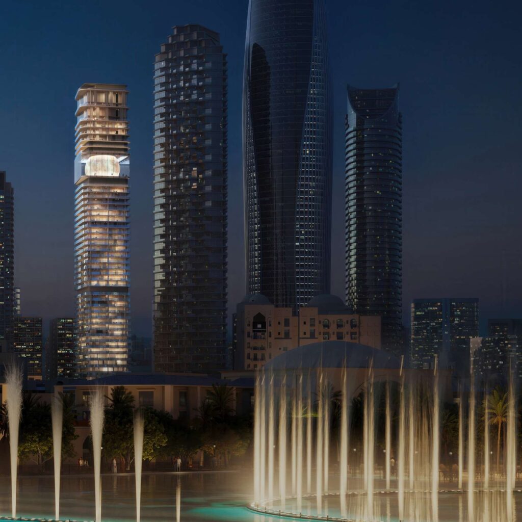 Inaura Hotels and Residences tower beside the Dubai Fountain at night, Downtown Dubai