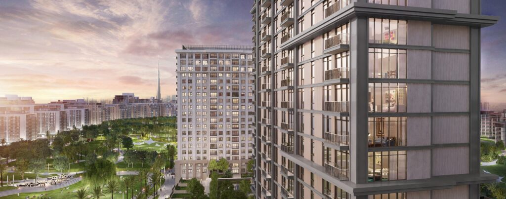 Residential towers overlooking green parkland and the city skyline at sunset at Lime Gardens, Dubai Hills Estate