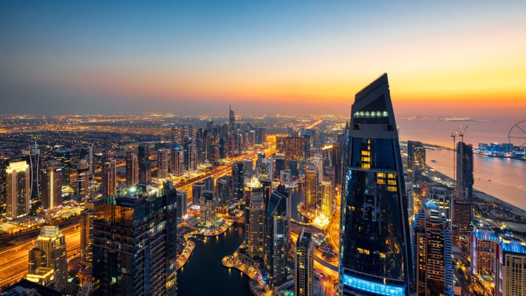 Marina skyline glowing at sunset seen from the waterfront of Marina Shores, Dubai Marina