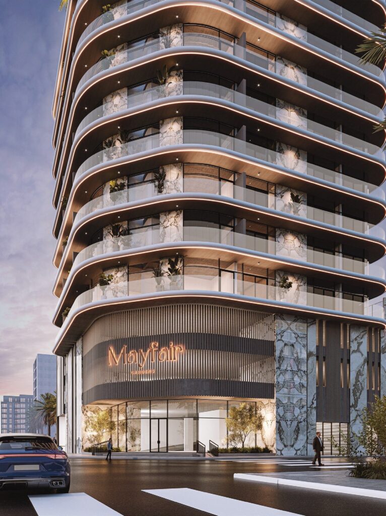 Mayfair Gardens tower with curved balconies at street level, Jumeirah Garden City, Dubai