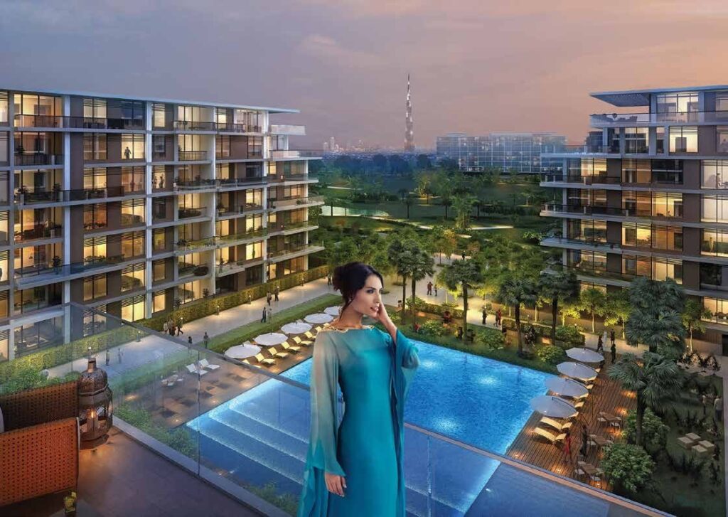 Resident by the glass edged pool at dusk at Mulberry Park Heights, Dubai Hills Estate