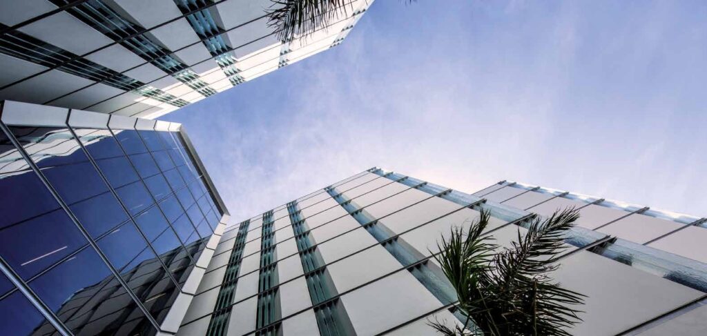 Looking up at the glass facade of Muraba Residences, Palm Jumeirah