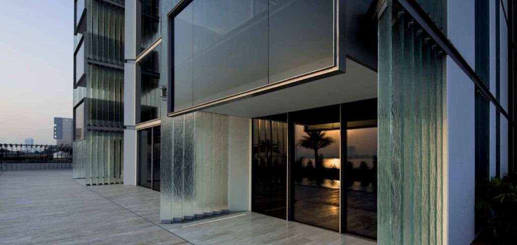 Cantilevered glass volume at the entrance of Muraba Residences, Palm Jumeirah