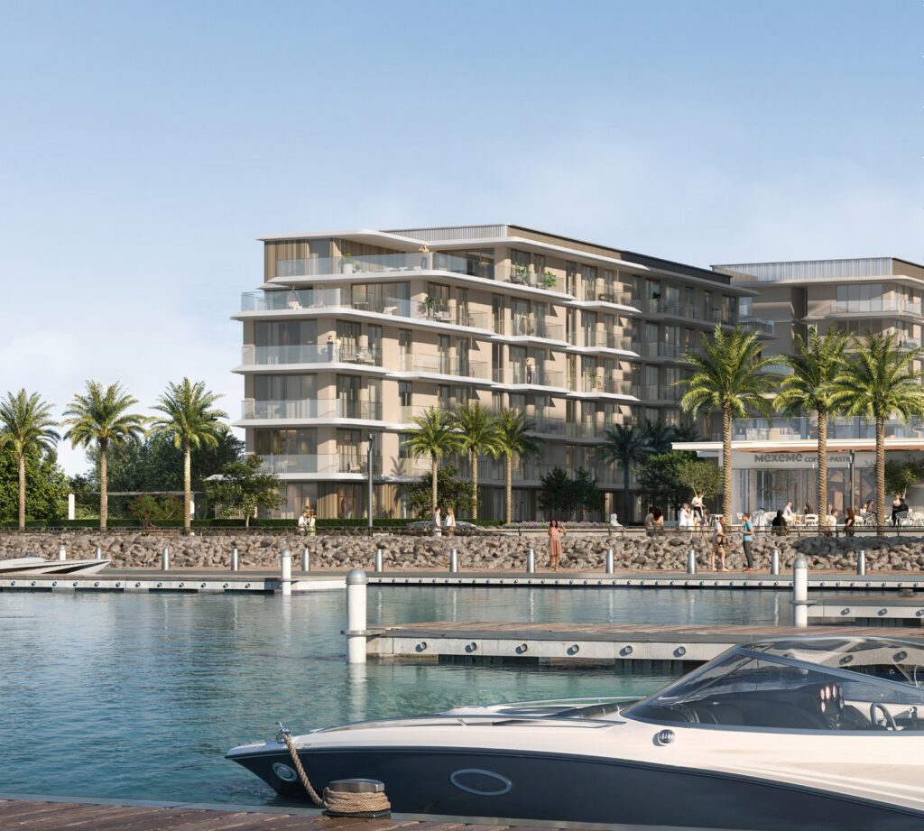 Ocean Views by Emaar buildings above the marina with a speedboat, Rashid Yachts and Marina