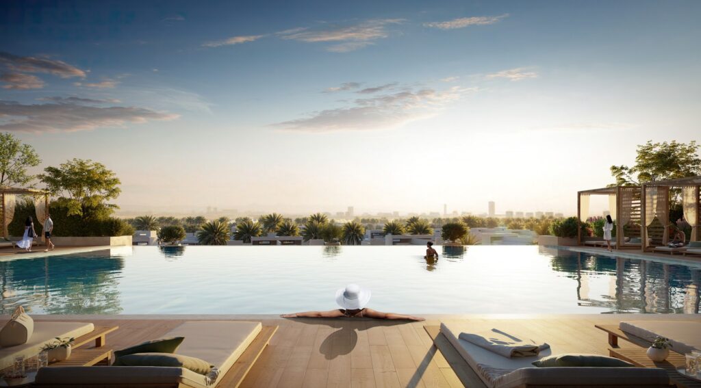 Infinity pool with loungers at sunset at Parkside Views, Dubai Hills Estate