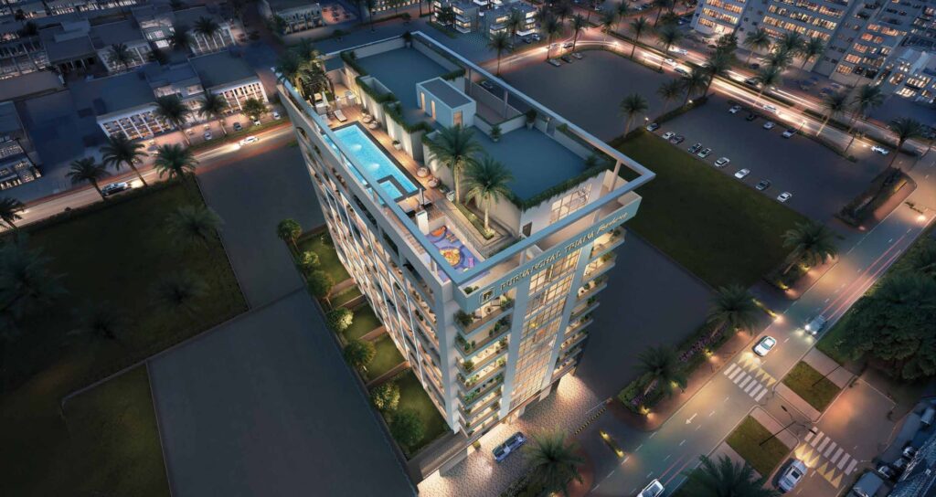 Aerial night view of Purvanchal Triana Residences with rooftop pool, Al Wasl, Dubai