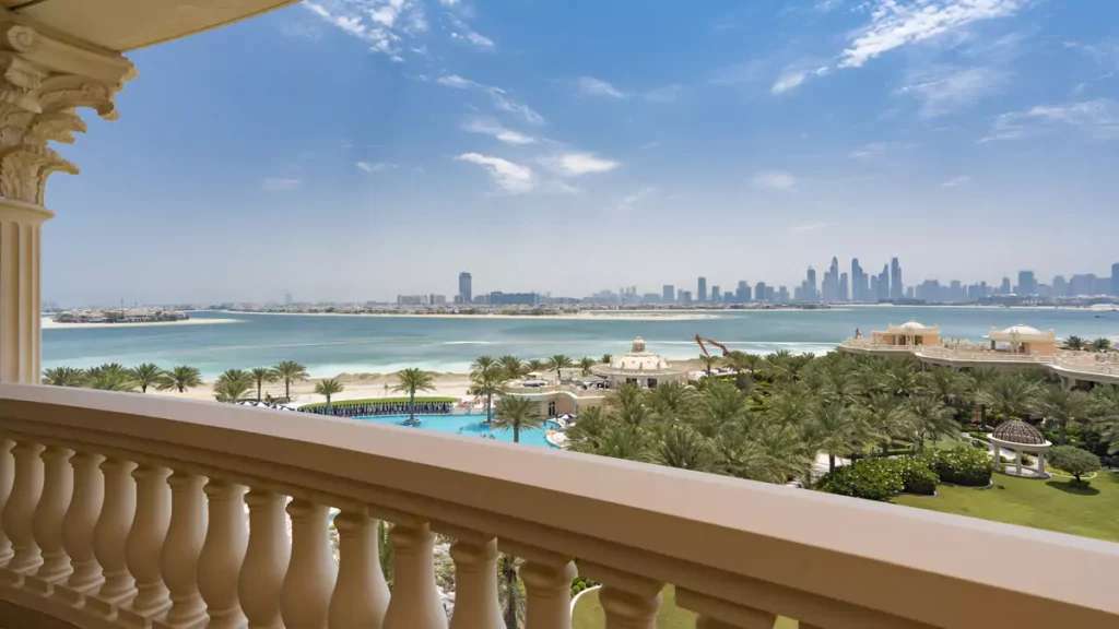 Balustraded terrace overlooking the beach and Dubai skyline at Raffles Residences The Palm, Palm Jumeirah