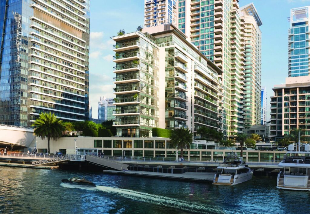 Residences Du Port building on the marina waterfront with yachts, Dubai Marina