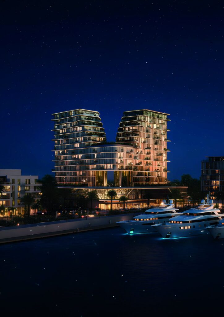 Royal Yacht Club Residence twin buildings lit at night by the marina, Dubai Islands