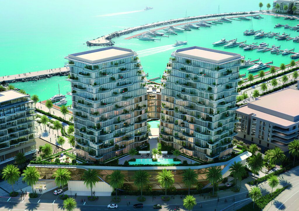 Aerial view of the Royal Yacht Club Residence twin towers and marina, Dubai Islands