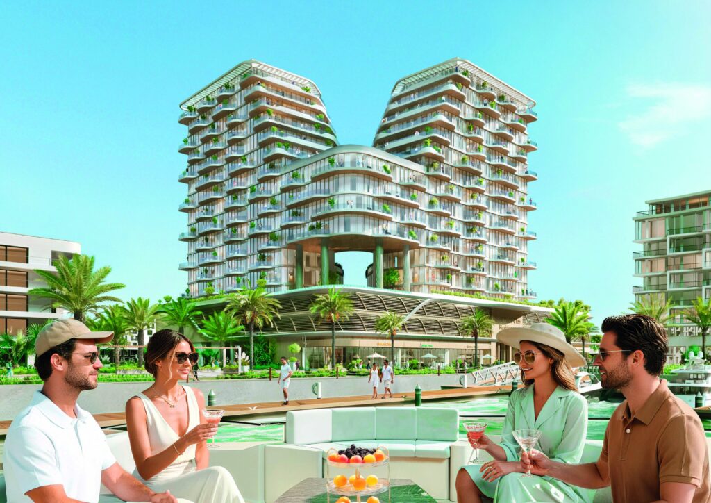 Residents relaxing by the pool below the Royal Yacht Club Residence towers, Dubai Islands