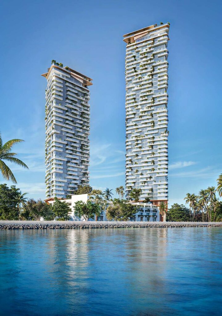 Soulever twin towers reflected in the sea, Dubai Maritime City