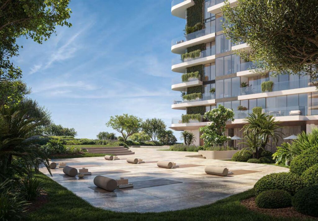 Landscaped plaza with seating at the base of Soulever, Dubai Maritime City