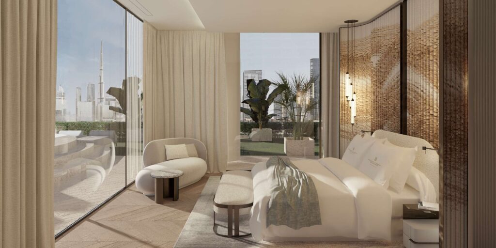 Living room with curved sofa and canal view at The Ritz Carlton Residences, Business Bay