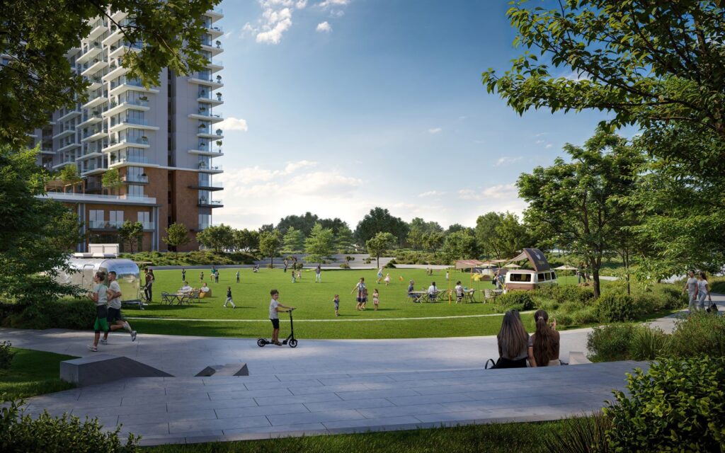 Park lawns and play areas below Vida Residences Hillside, Dubai Hills Estate