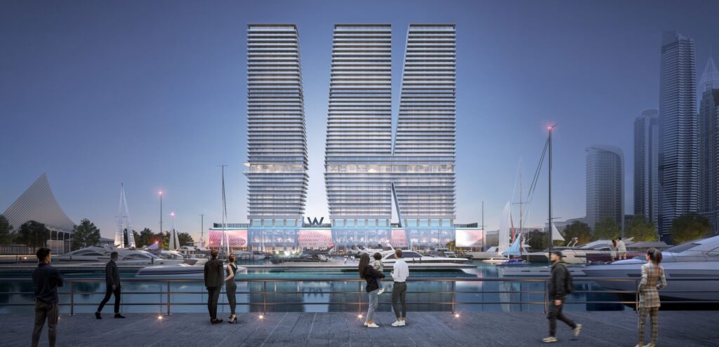 W Residences Dubai Harbour twin towers across the marina at dusk