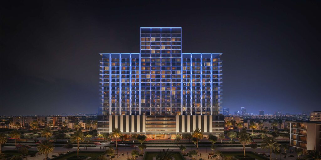 Binghatti Ruby residential tower illuminated at night in JVC Dubai